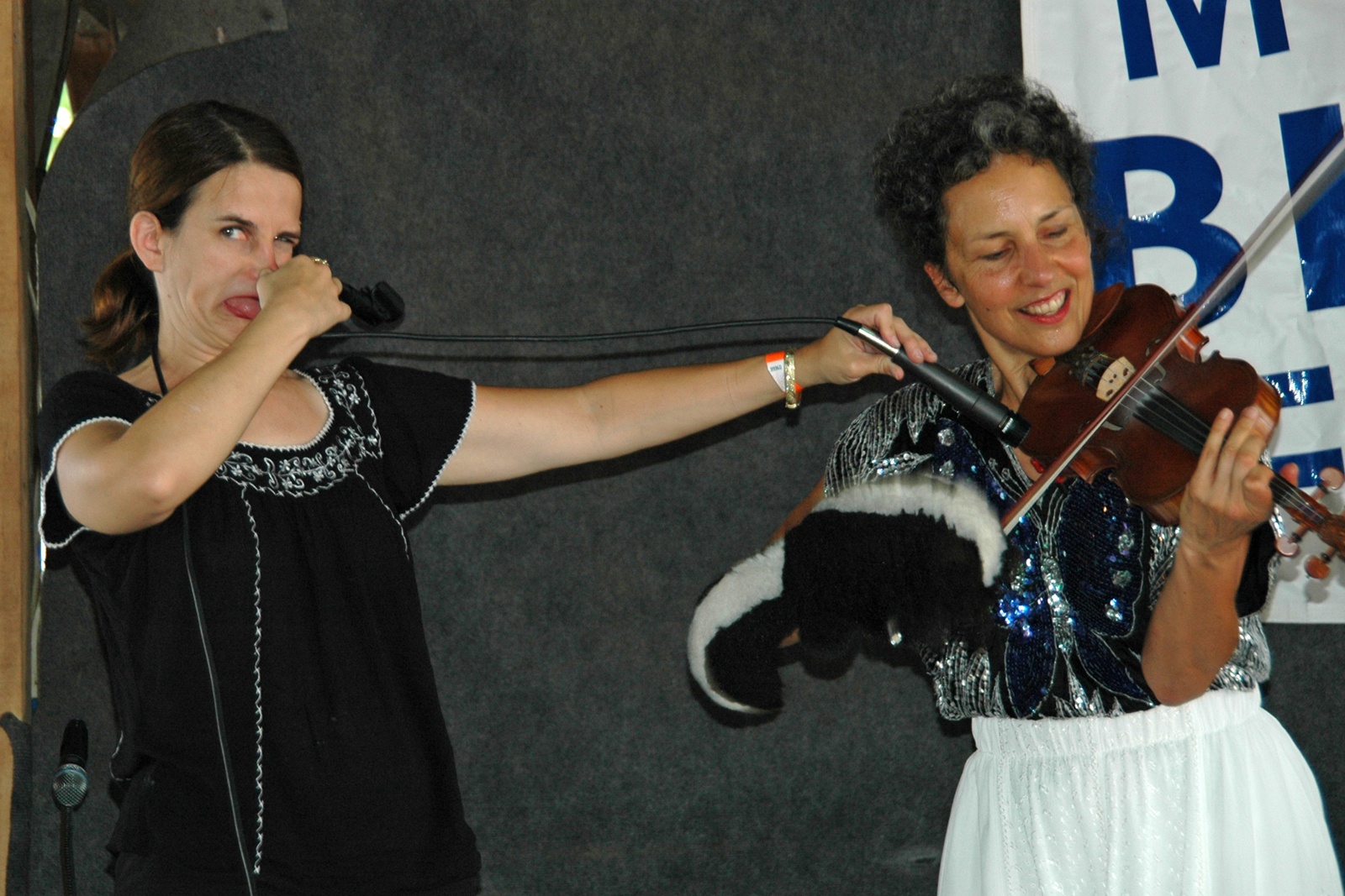 Kitty McIntyre, bluegrass fiddler for Vernon McIntyre's Appalachian Grass, doing her trick fiddle act.