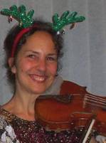 Kitty McIntyre, bluegrass fiddler, with reindeer antlers for Christmas party