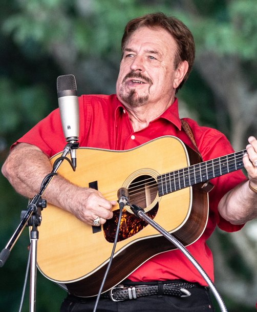 picture of Vernon McIntyre performing with his band Appalachian Grass at the Greenhills Commons in 2018. 