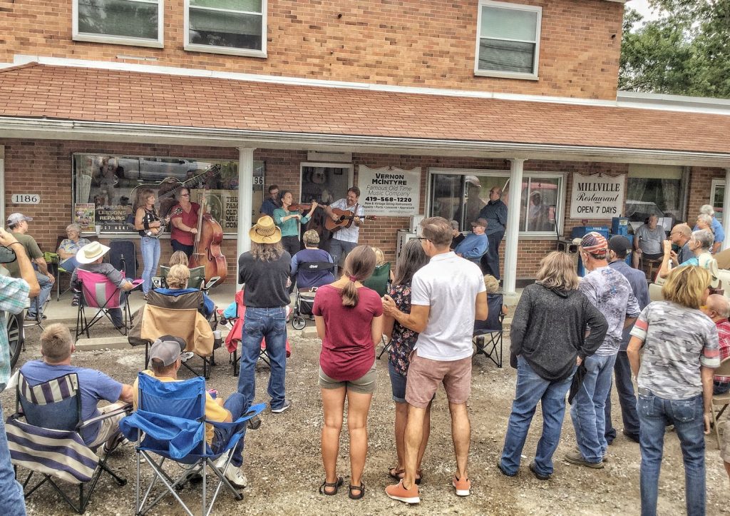 picture of concert by Vernon McIntyre's Appalachian Grass in front of store at Vernon McIntyre's Famous Old Time Music Company Grand Opening August 31, 2019